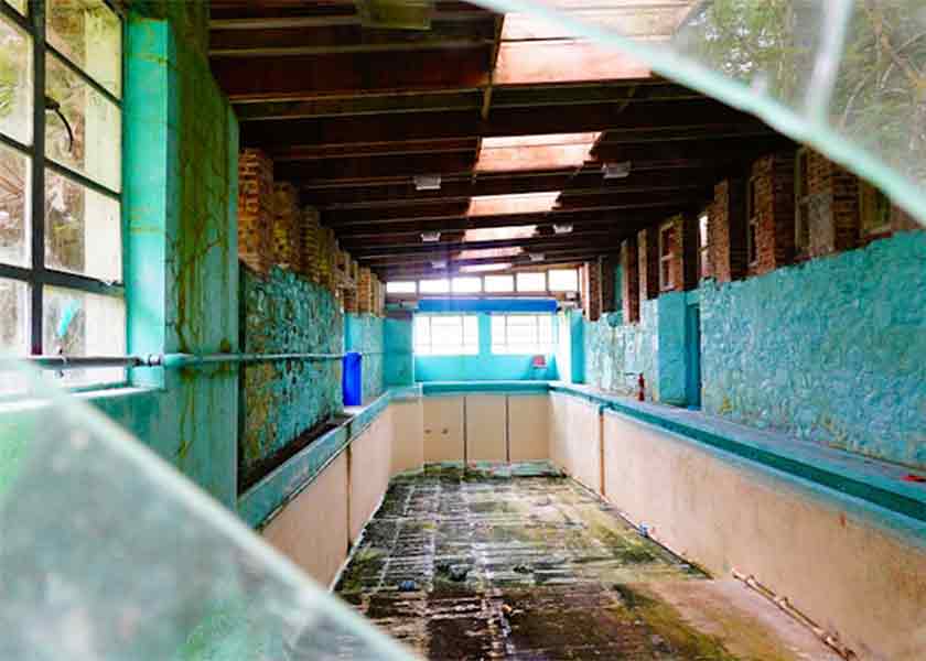 Broken Glass Framing Abandoned Room